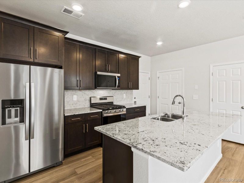 Furnished interior view inside a new home in Skyview at High Point, Aurora (Image 12).