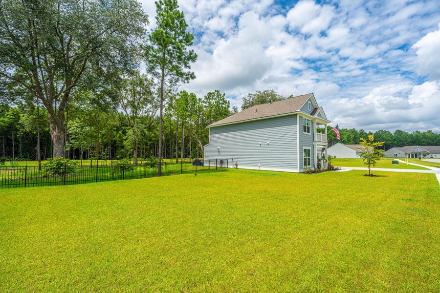 Front exterior of a new home in Sea Island Preserve, Johns Island, SC, highlighting curb appeal (Image 26).