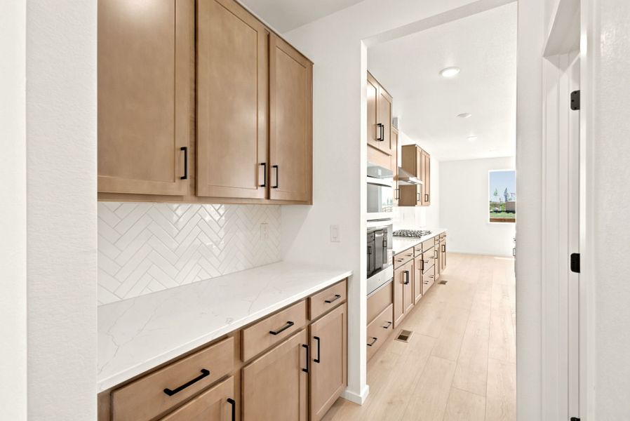 Furnished interior view inside a new home in Cordovan, Firestone (Image 10).