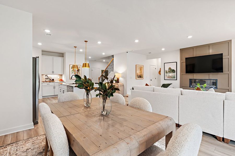 A living room with a large table and a couch. A living room with a large table and a couch.