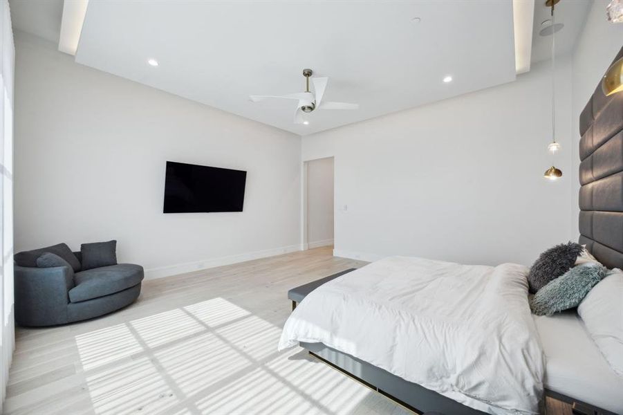 Bedroom with light wood-type flooring and ceiling fan