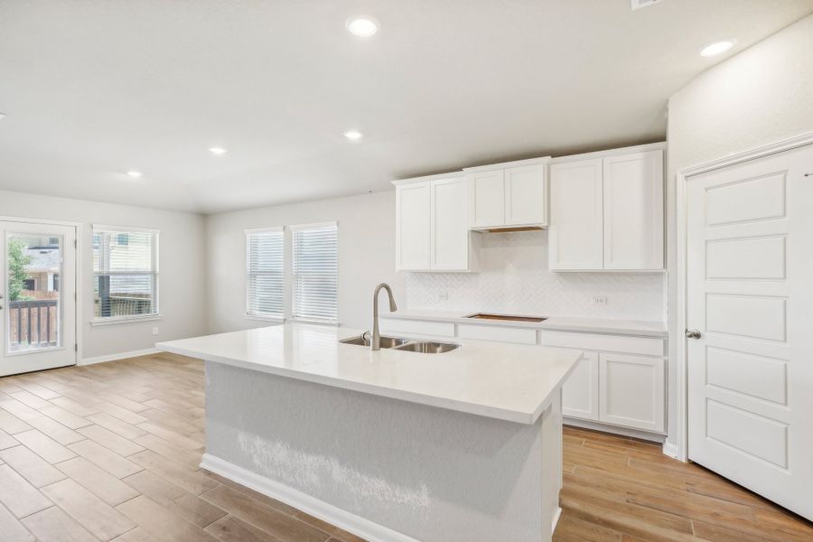 Kitchen in the Fitzhugh floorplan at a Meritage homes community.