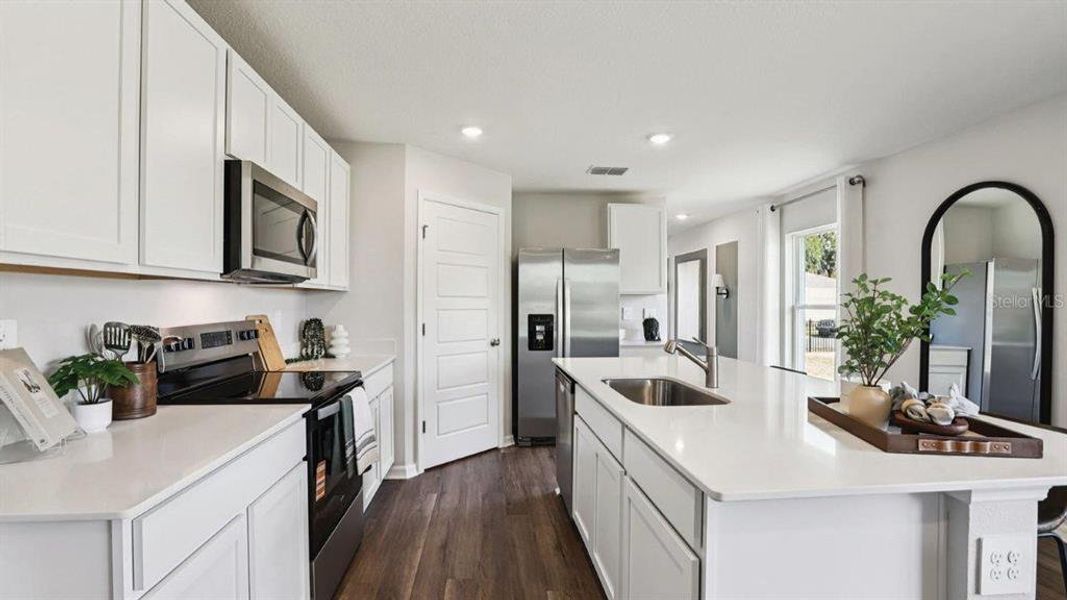 Furnished interior view inside a new home in Lake Deer Estates, Poinciana (Image 12).