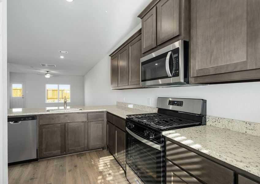 The kitchen of the Driftwood has beautiful wood cabinetry.