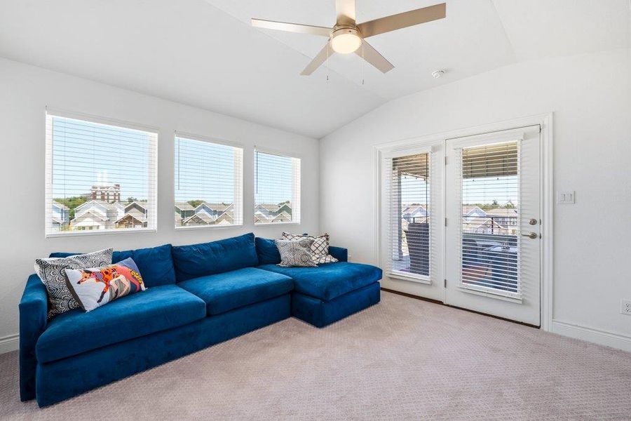 Plentiful natural light streams across the carpeted floor from multi-aspect windows and glass patio doors. Plentiful natural light streams across the carpeted floor from multi-aspect windows and glass patio doors.