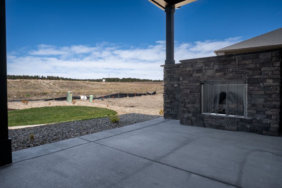 Exterior details and patio area of a home in Wolf Ranch - Enclave Collection, Colorado Springs (Image 4).