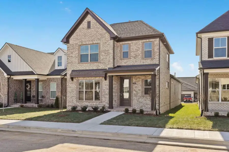 Front exterior of a new home in , Gallatin, TN, highlighting curb appeal (Image 1). Front exterior of a new home in , Gallatin, TN, highlighting curb appeal (Image 1).
