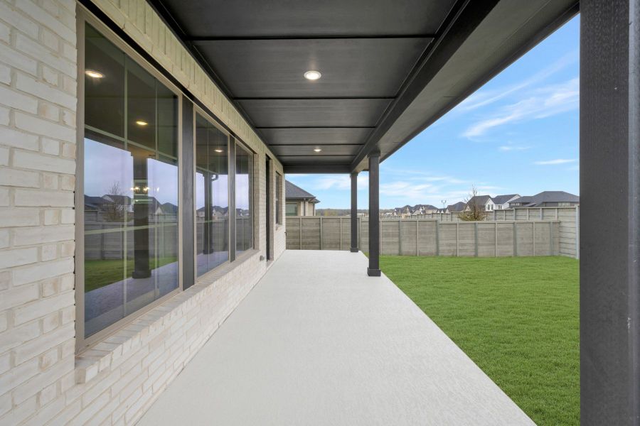 Exterior details and patio area of a home in Treeline, Justin (Image 4).