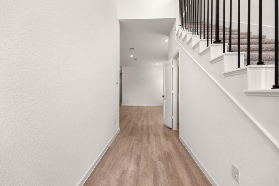 Spacious, unfurnished interior of a new home in Sunterra, Katy (Image 35).