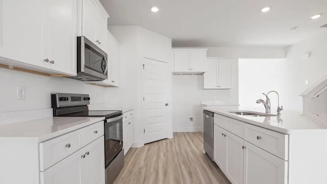 Furnished interior view inside a new home in Bayside at Ward Creek, Panama City Beach (Image 5).