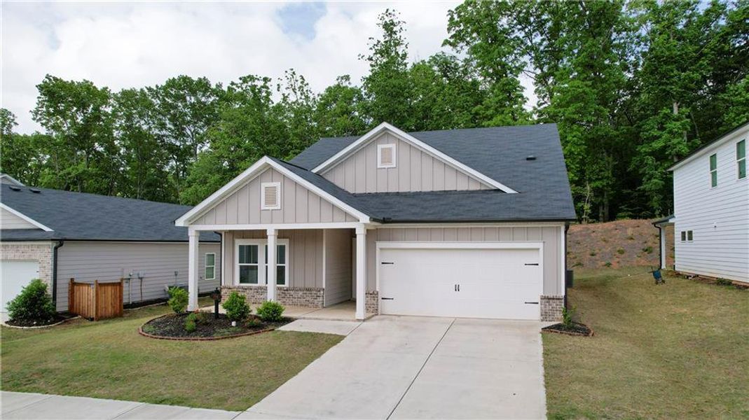 Front exterior of a new home in , Canton, GA, highlighting curb appeal (Image 24).