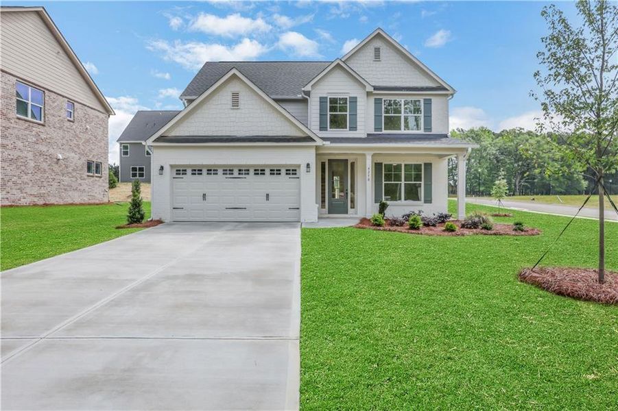 Front exterior of a new home in , Loganville, GA, highlighting curb appeal (Image 22).