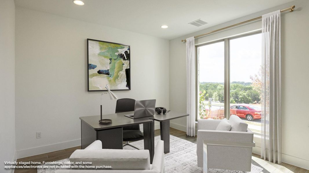 Office area featuring wood finished floors and recessed lighting