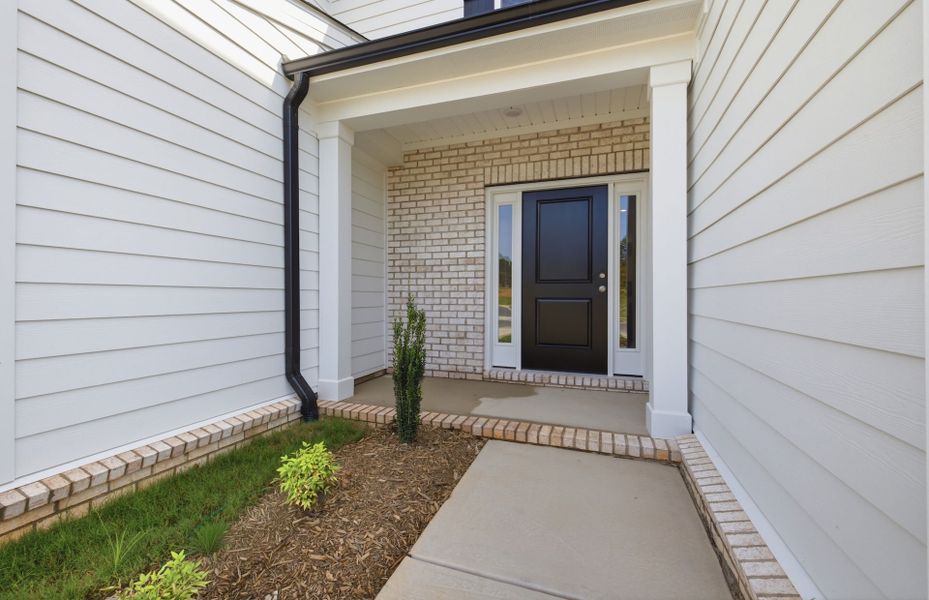 Exterior details and patio area of a home in Cambria, Garner (Image 3).