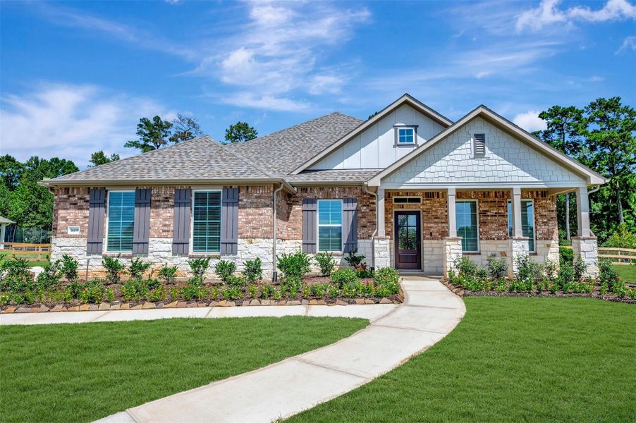 Front exterior of a new home in Lone Star Landing, Montgomery, TX, highlighting curb appeal (Image 2). Front exterior of a new home in Lone Star Landing, Montgomery, TX, highlighting curb appeal (Image 2).