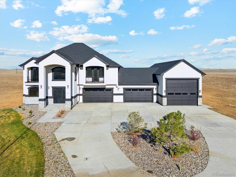 Front exterior of a new home in , Hudson, CO, highlighting curb appeal (Image 25).