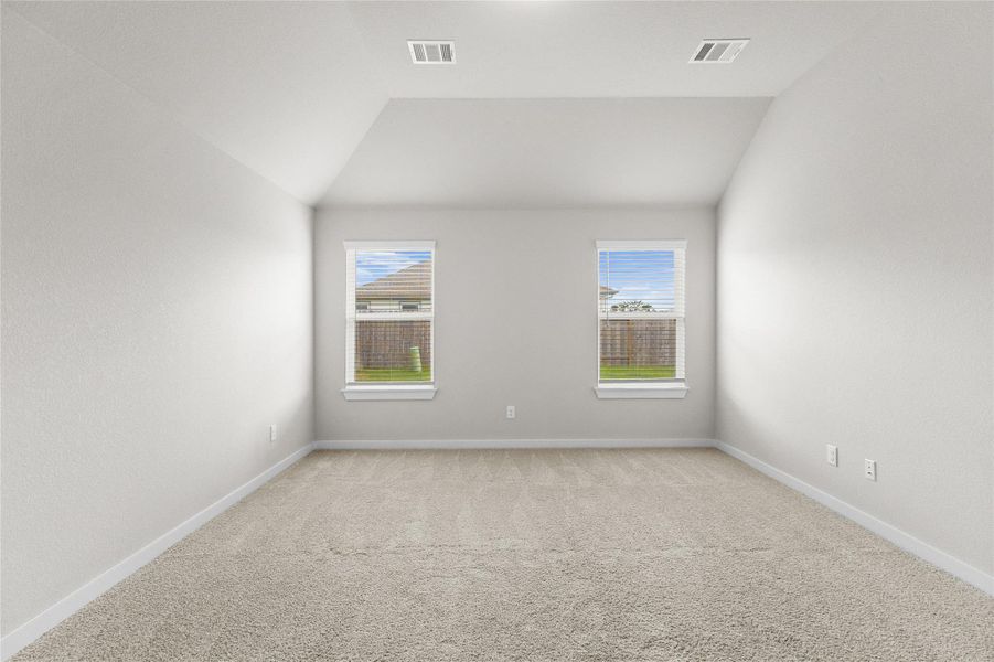 This primary suite impresses with soaring vaulted ceilings that add volume and light to the space, while two oversized windows flood the room with natural sunlight throughout the day. Soft neutral walls and plush carpet create a warm, move-in ready canvas, offering a peaceful retreat at the end of the day. It's a room designed for comfort and calm, with generous square footage that leaves plenty of room to make it your own. This primary suite impresses with soaring vaulted ceilings that add volume and light to the space, while two oversized windows flood the room with natural sunlight throughout the day. Soft neutral walls and plush carpet create a warm, move-in ready canvas, offering a peaceful retreat at the end of the day. It's a room designed for comfort and calm, with generous square footage that leaves plenty of room to make it your own.