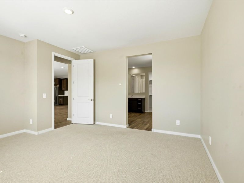 Spacious, unfurnished interior of a new home in White Tank Foothills Signature Series, Waddell (Image 11).