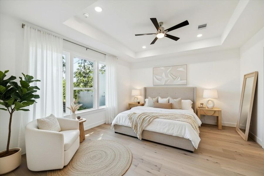 This spacious primary bedroom is the perfect combination of comfort, style, and sophistication. This spacious primary bedroom is the perfect combination of comfort, style, and sophistication.