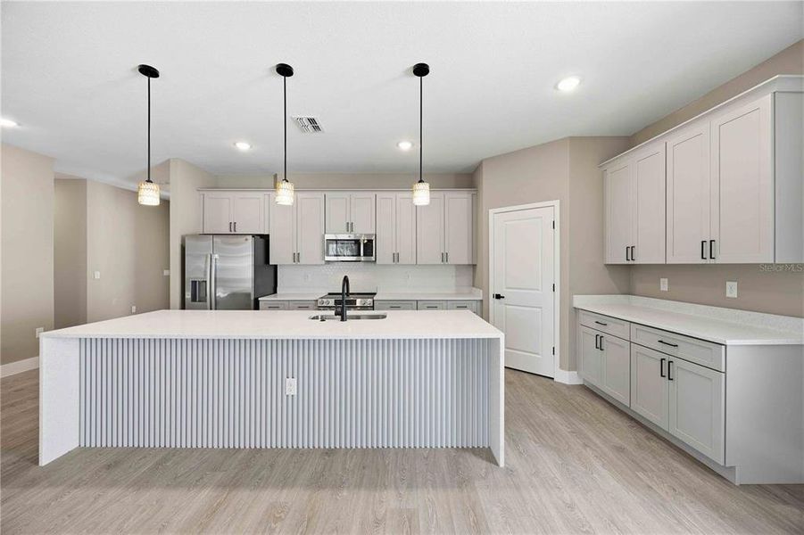 Furnished interior view inside a new home in , Winter Haven (Image 4). Furnished interior view inside a new home in , Winter Haven (Image 4).