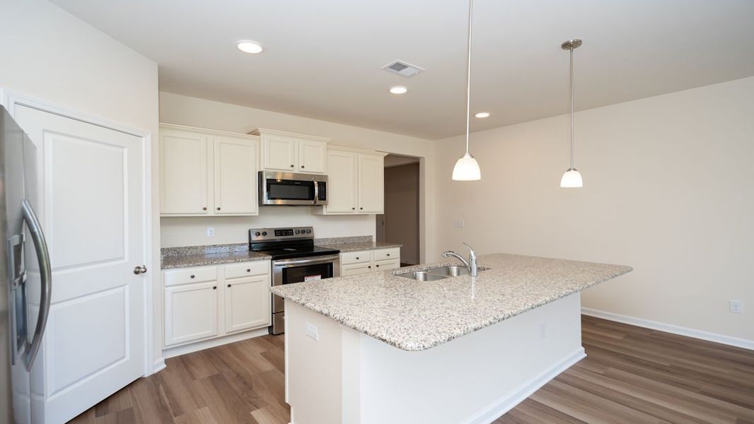 Representative furnished interior of a home built from the CALI by D.R. Horton in Lochaven, Conway (Image 10).