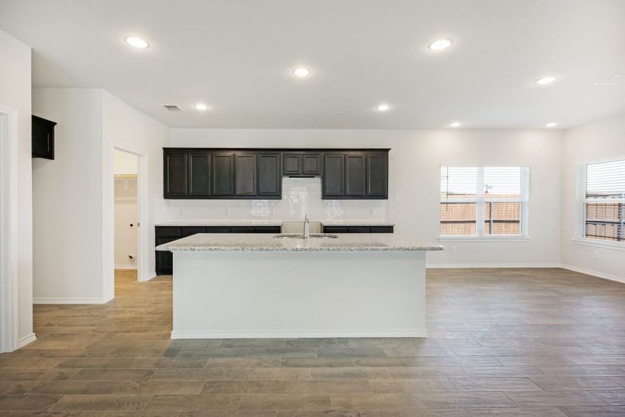 Representative exterior photo of a completed home built from the Lockhart by Impression Homes in Heartland, Heartland, TX (Image 6). Representative exterior photo of a completed home built from the Lockhart by Impression Homes in Heartland, Heartland, TX (Image 6).