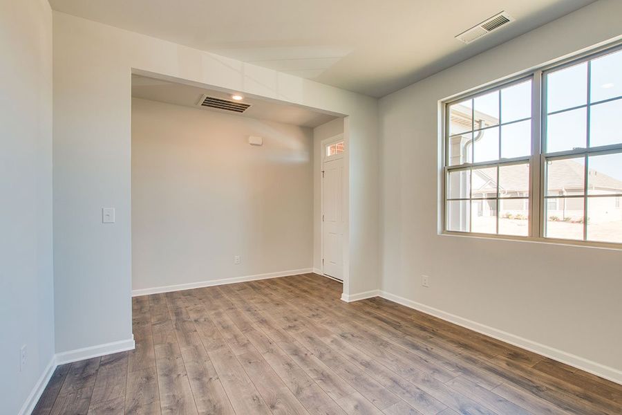 Representative unfurnished interior of a home built from the HAYDEN by D.R. Horton in The Parks, White House (Image 11).