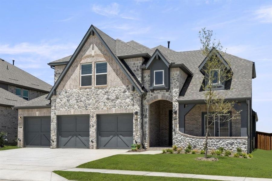 Front exterior of a new home in Spiritas Ranch, Little Elm, TX, highlighting curb appeal (Image 24).