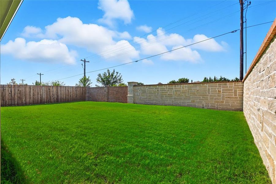 View of fenced backyard