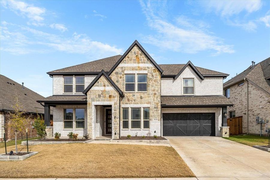 Front exterior of a new home in Sonoma Verde, McLendon-Chisholm, TX, highlighting curb appeal (Image 21).