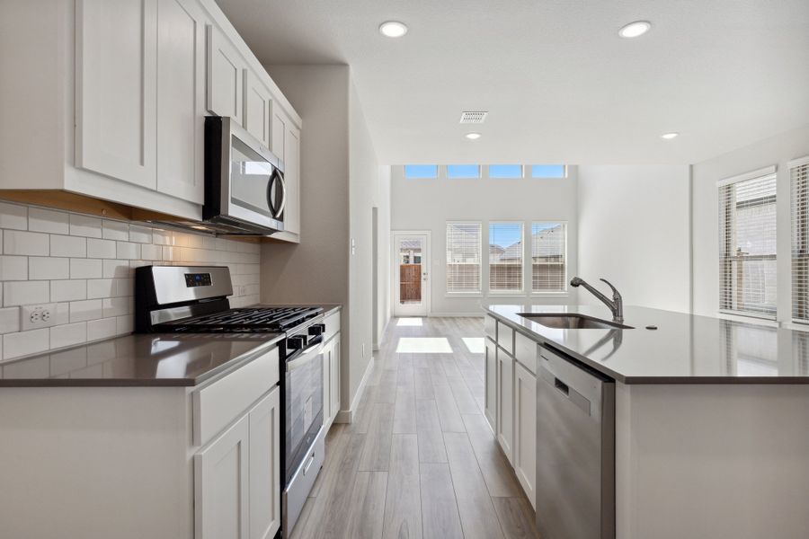 Kitchen in the Mesquite home plan by Trophy Signature Homes – REPRESENTATIVE PHOTO