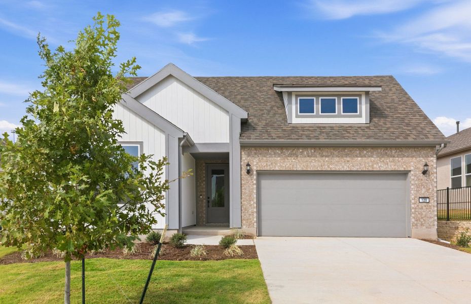 Front exterior of a new home in Sun City Texas, Georgetown, TX, highlighting curb appeal (Image 23). Front exterior of a new home in Sun City Texas, Georgetown, TX, highlighting curb appeal (Image 23).