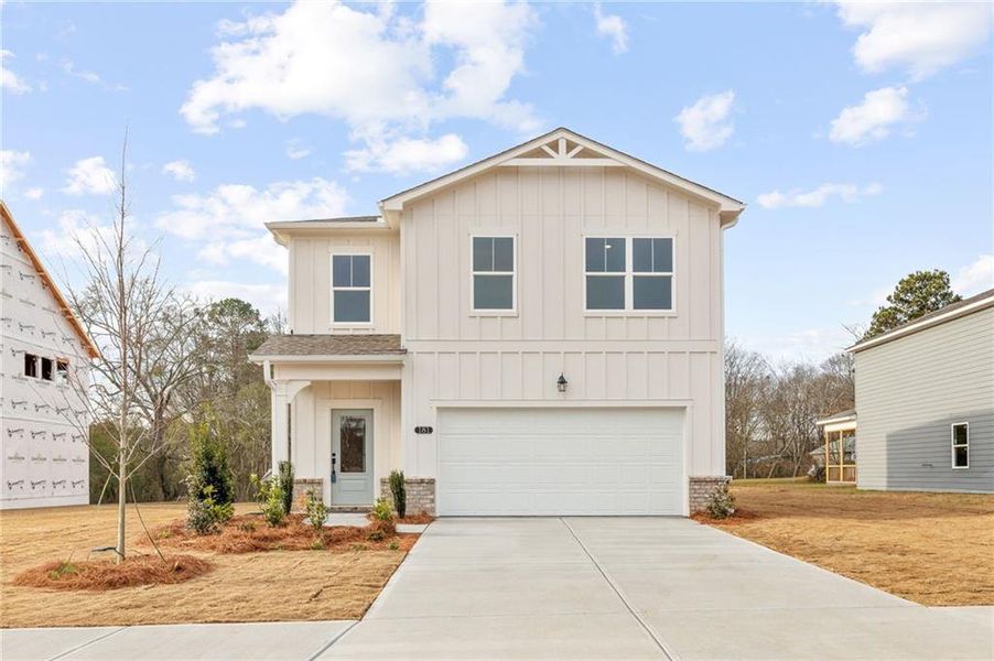 Front exterior of a new home in The Bluffs, Canton, GA, highlighting curb appeal (Image 2). Front exterior of a new home in The Bluffs, Canton, GA, highlighting curb appeal (Image 2).