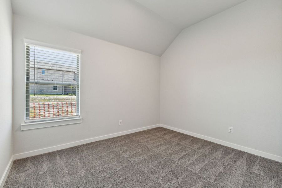 Bedroom in the Amber home plan by Trophy Signature Homes – REPRESENTATIVE PHOTO