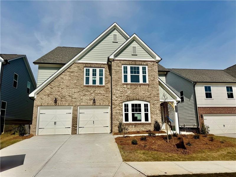 Front exterior of a new home in Eastlyn Crossing, Flowery Branch, GA, highlighting curb appeal (Image 8).