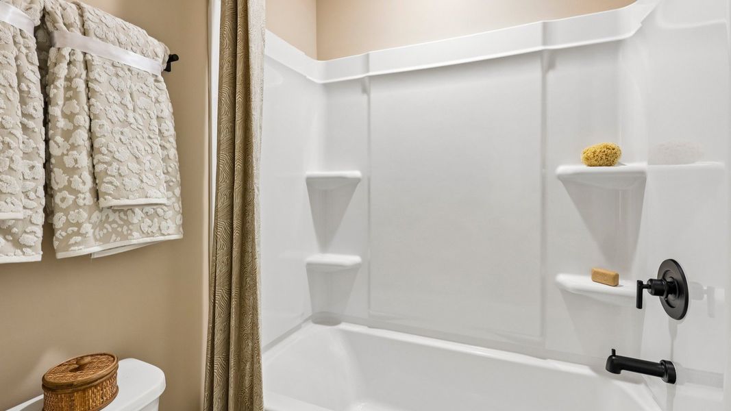 Secondary bathroom with shower and toilet Secondary bathroom with shower and toilet