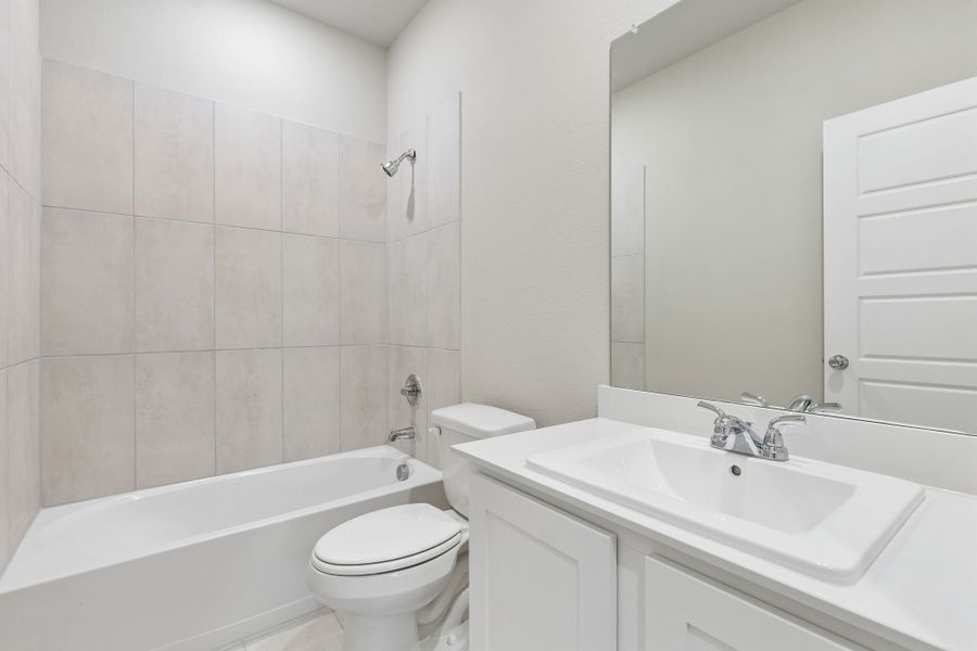 Bathroom in the Emmy II home plan by Trophy Signature Homes - REPRESENTATIVE PHOTO