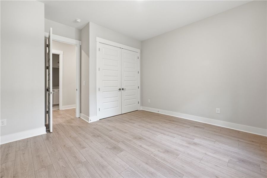 Smooth wood flooring and clean lines define this v