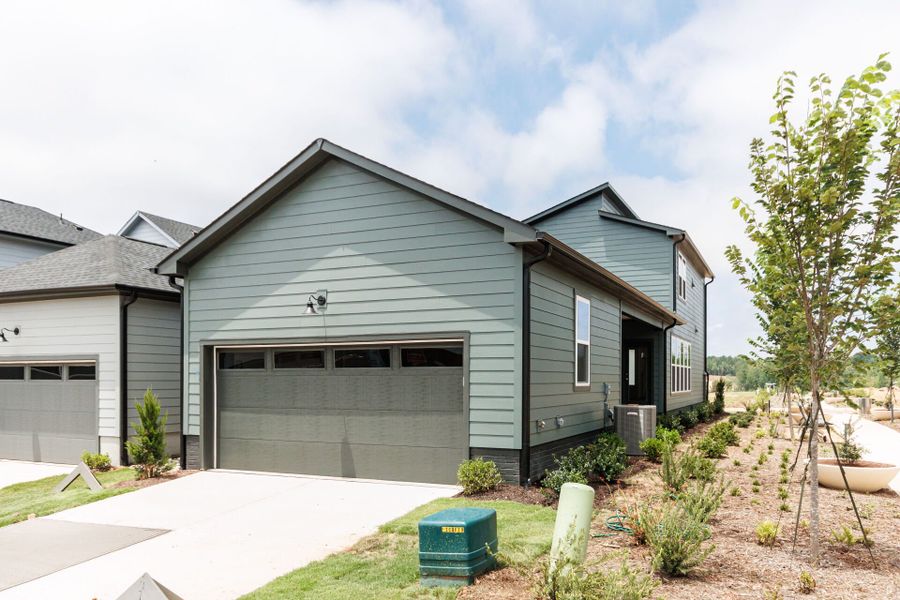 Representative exterior photo of a completed home built from the The Whitmer by David Weekley Homes in NoVi Chatham Park - The Mews Collection, Pittsboro, NC (Image 1). Representative exterior photo of a completed home built from the The Whitmer by David Weekley Homes in NoVi Chatham Park - The Mews Collection, Pittsboro, NC (Image 1).