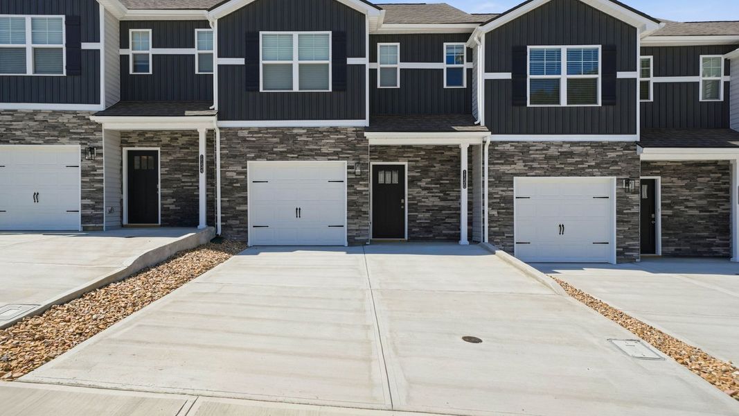 Front exterior of a new home in The Arbor Townhomes, Kingsport, TN, highlighting curb appeal (Image 2). Front exterior of a new home in The Arbor Townhomes, Kingsport, TN, highlighting curb appeal (Image 2).