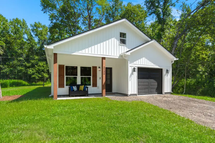 Front exterior of a new home in , Ravenel, SC, highlighting curb appeal (Image 1). Front exterior of a new home in , Ravenel, SC, highlighting curb appeal (Image 1).