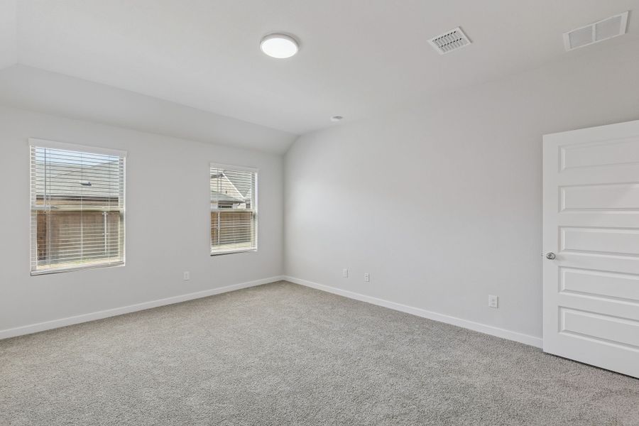 Primary Suite in the Harrison home plan by Trophy Signature Homes – REPRESENTATIVE PHOTO