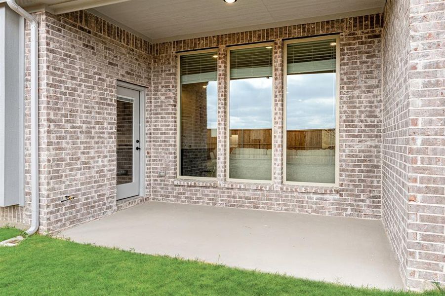 Exterior details and patio area of a home in ArrowBrooke, Aubrey (Image 26).