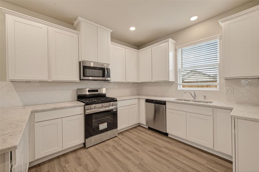 Furnished interior view inside a new home in Sunterra, Katy (Image 5).
