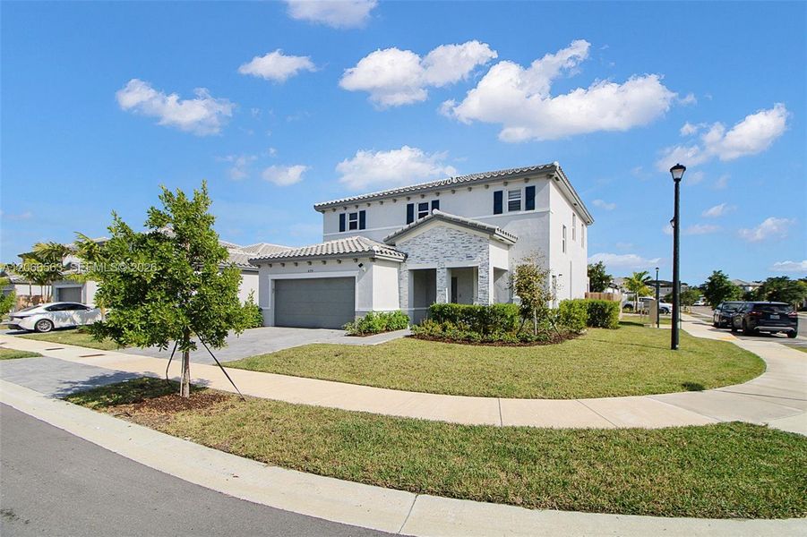Front exterior of a new home in , Homestead, FL, highlighting curb appeal (Image 25).