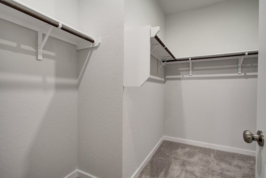 A white wall with a metal bar. A white wall with a metal bar.