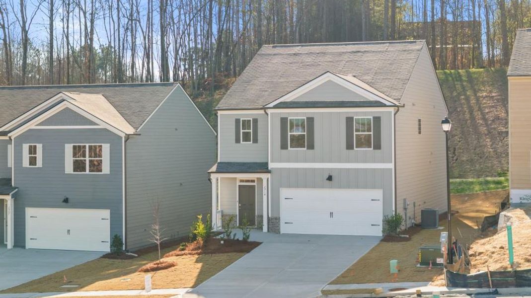 Front exterior of a new home in Oconee Overlook, Gainesville, GA, highlighting curb appeal (Image 22). Front exterior of a new home in Oconee Overlook, Gainesville, GA, highlighting curb appeal (Image 22).