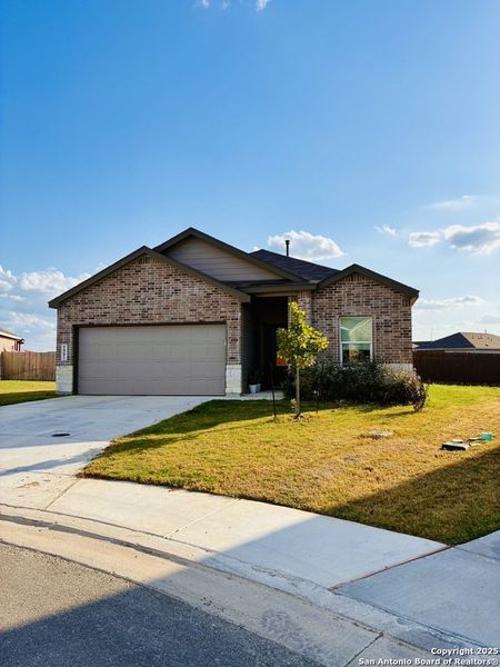 Front exterior of a new home in Navarro Ranch: Coastline Collection, Seguin, TX, highlighting curb appeal (Image 2). Front exterior of a new home in Navarro Ranch: Coastline Collection, Seguin, TX, highlighting curb appeal (Image 2).