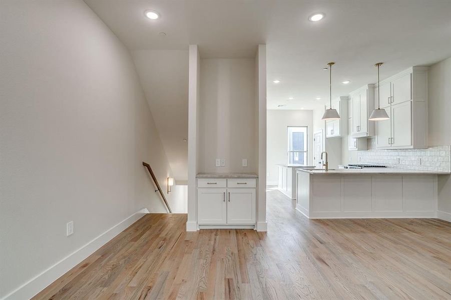 Open-concept living room with 10-foot ceilings and hardwood floors at Linwood Quarter. Open-concept living room with 10-foot ceilings and hardwood floors at Linwood Quarter.