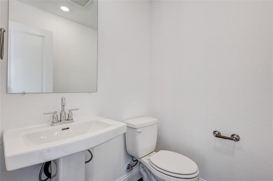 Bathroom with toilet and sink